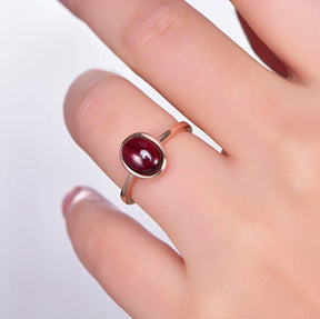 Bezel-Set Oval Cabochon Red Garnet Solitaire Ring 14K Rose Gold - Lord of Gem Rings