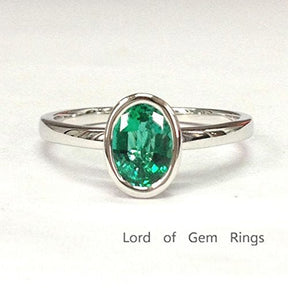 Bezel-Set Oval Emerald Solitaire Ring 14K White Gold - Lord of Gem Rings