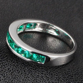 Channel-Set Princess Emerald Half Eternity May Birthstone Band - Lord of Gem Rings