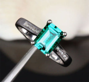 Cross Prong Emerald Cut Emerald Engagement Ring Channel Set Diamond Accents - Lord of Gem Rings