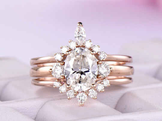 Tiara Three-Stone Oval Moissanite Ring Trio Bridal Set